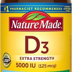 Nature Made Vitamin D3 5000 IU Softgels bottle placed beside a cup of coffee and a truck keychain on a dashboard — symbolizing daily wellness for drivers on the go.